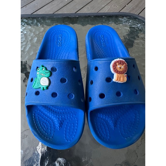 Crocs Kids Blue Slide Sandals with Lion and Dinosaur Charms - Picture 1 of 6